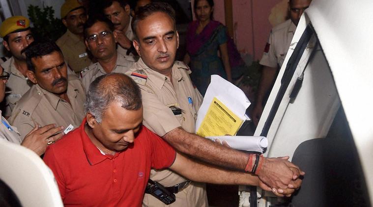 New Delhi: AAP MLA Somnath Bharti being taken into custody after he surrendered at the Dwarka North Police Station in New Delhi on Monday. PTI Photo by Manvender Vashist (PTI9_28_2015_000378A)