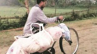 Assam, man, carries, brothers, body on cycle