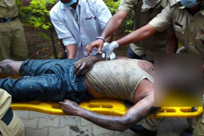 एका मृत कामगाराचे छायाचित्र