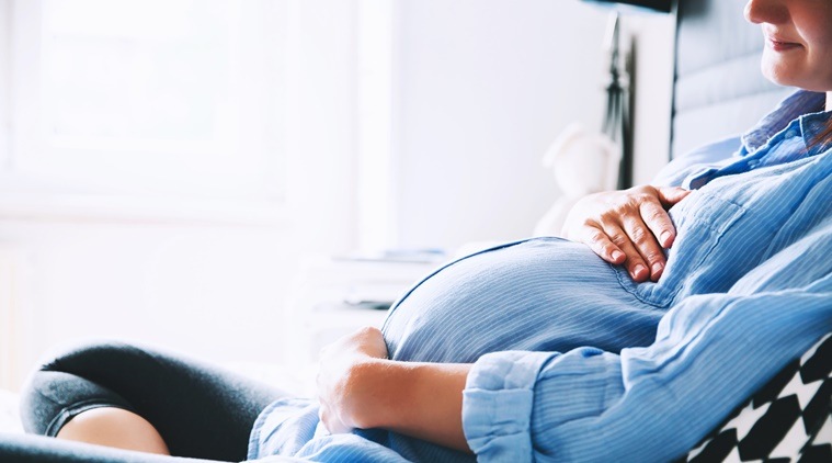 Beautiful pregnant woman at home.