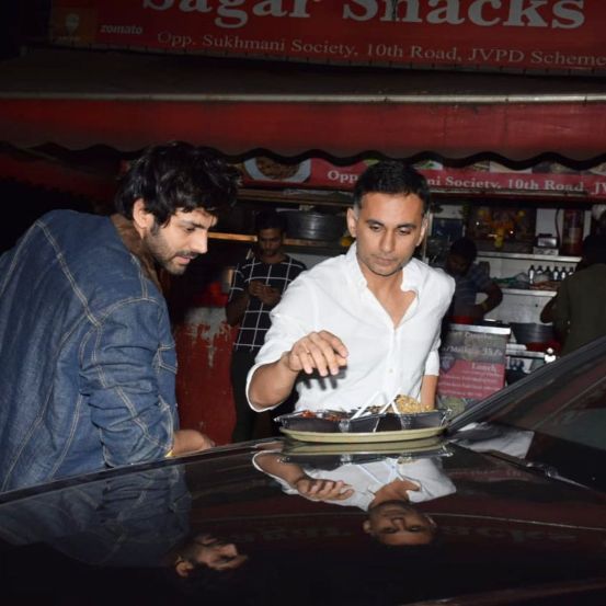 Chinese van food on Lamborghini bonnet Kartik Aaryan roadside foodscape on way back from Bigg Boss 15