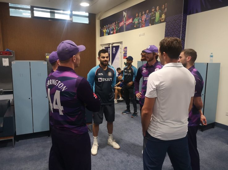 Scotland players visit Indian dressing room