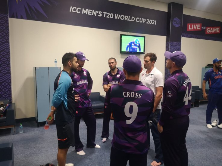 Scotland players visit Indian dressing room