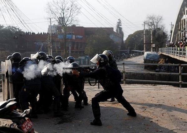 Police clash with protesters in Nepal over US grant