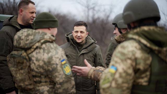 In military uniform defiant President Volodymyr Zelensky vows to defend Ukraine People called him real hero