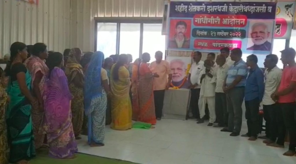 Gandhigiri of farmer widows carrying flowers to the image of Prime Minister Modi
