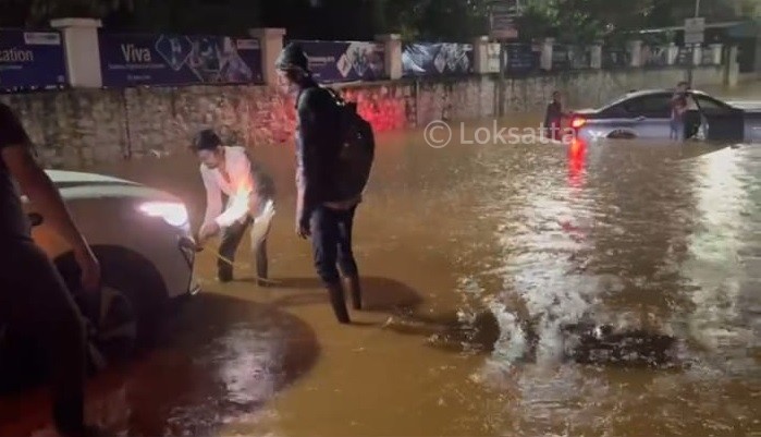 Pune Rain Photos A BMW 5 series car held on a submerged road near Vibgyor school at NIBM annex