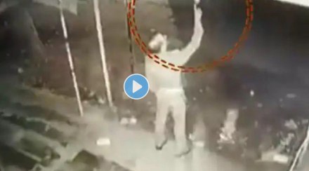 police stealing bulb from outside store