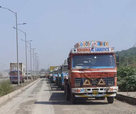 Container parking on service roads and also on regular roads in Uran
