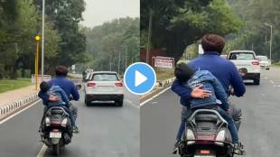 Watch how man prevents his son from falling off a moving scooter video goes viral