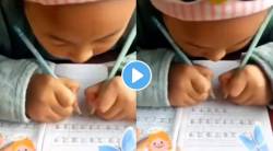चक्क दोन्ही हातांनी लिहितेय ही चिमुकली; Viral Video पाहून नेटकरीही झाले थक्क