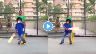 Man playing cricket with one hand