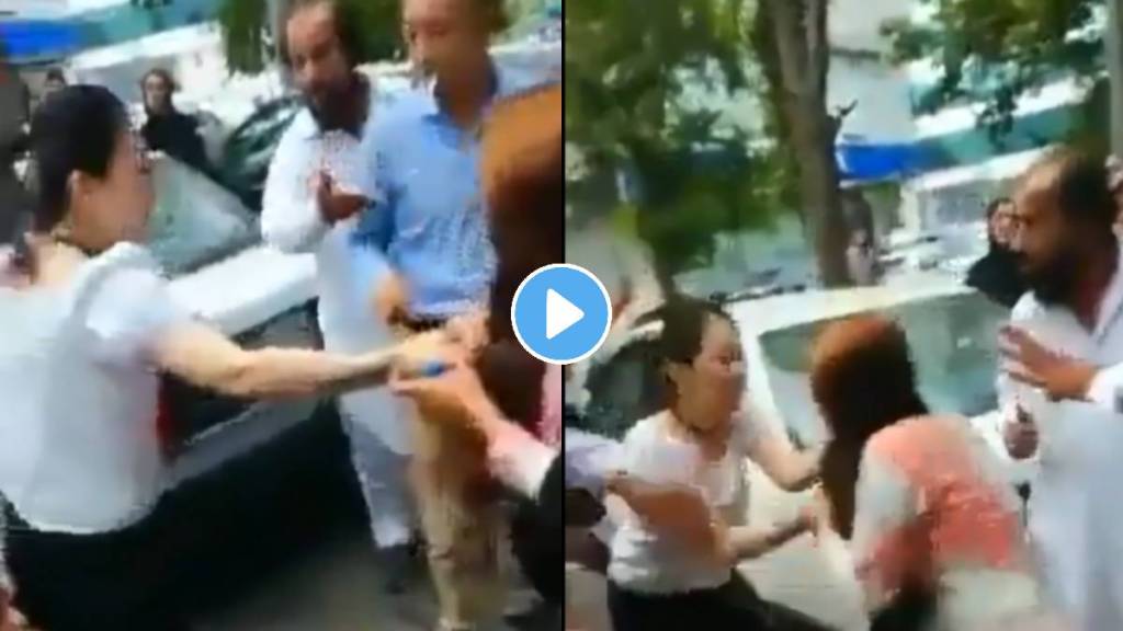 Chinese woman and Pakistani woman fight on street Chinese woman and Pakistani woman fight on street