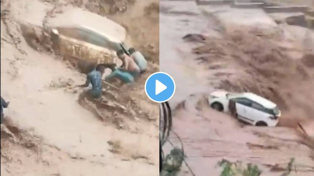 Women being rescued from car swept in water from the people in Panchkula, Haryana.Due to heavy rains cause flooding