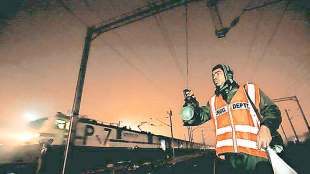 employees to check automatic system in railway