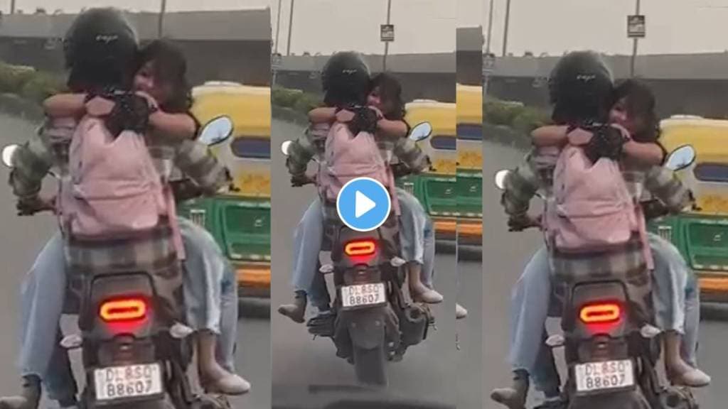 Couple doing romance while driving bike on delhi road and break traffic rules then what happened video trending of internet