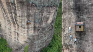 Store Hangs From A Large Cliff In China Sells snacks To Rock Climbers.