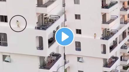 kid walks on edge of a building kid walks on edge of a building