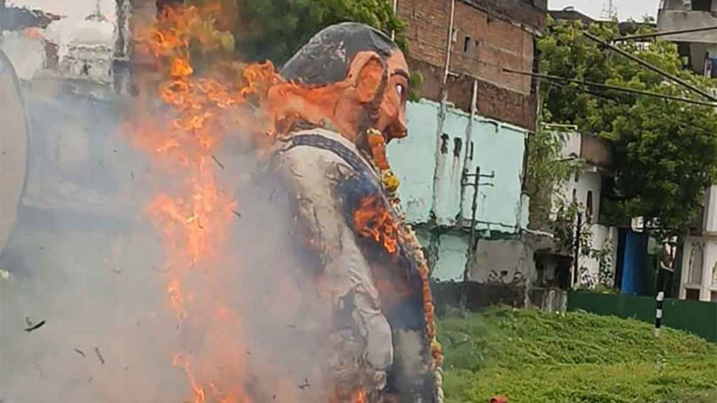 devotees burn effigies to destroy evil forces