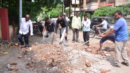symbolic movement to fill the pothole