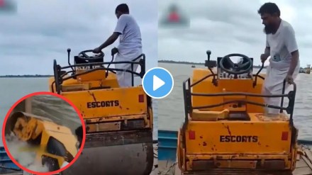 man putting Road Roller on the boat man putting Road Roller on the boat