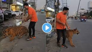 A young man walking with a tiger on the streets of Pakistan Video viral
