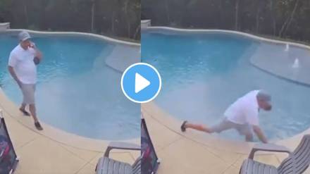 man kept talking on the phone despite falling in swimming pool video