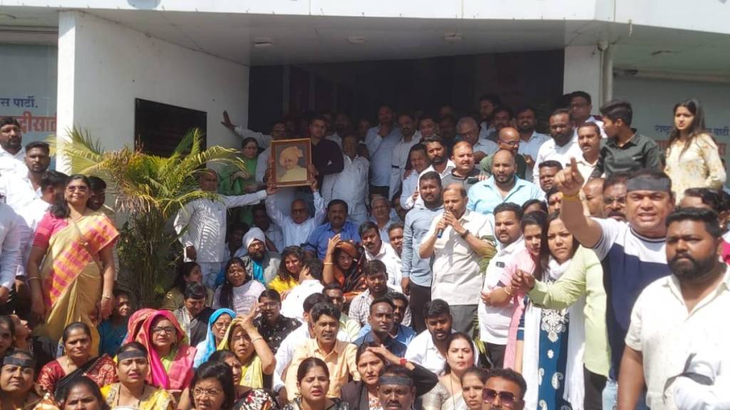 sharad pawar faction protest in pune by wearing black ribbons after giving party symbol and name to ajit pawar