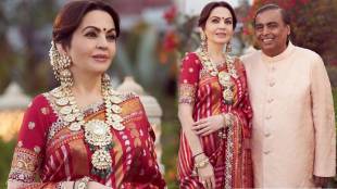 nita ambani red kanchipuram saree with initials of her son anant ambani and daughter in law radhika merchant