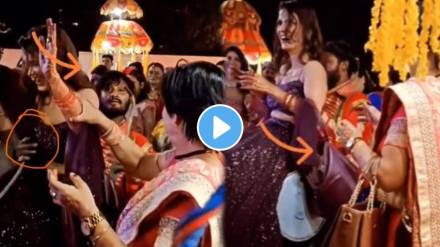 At the wedding ceremony the drummer grabbed the woman's waist