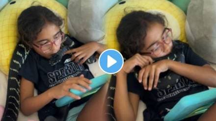 The little girl is hugging and kissing the snake