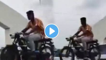 man seen skillfully yet riskily riding his bike on a Bridge divider did not even wear a helmet watch viral video