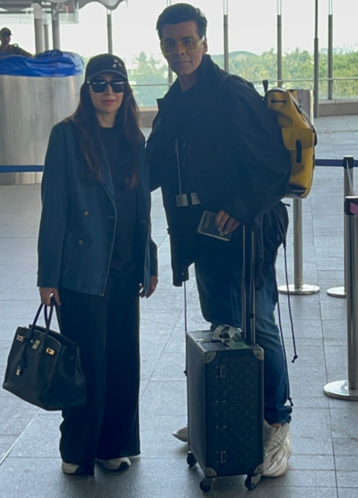 Karisma Kapoor and Karan Johar posed together as they were spotted at the airport. (Photo: Varinder Chawla)