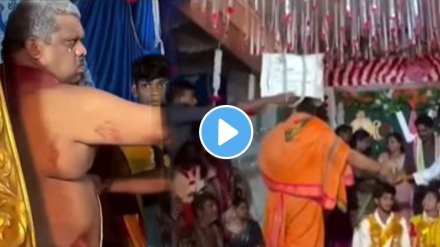 Groom's friends put a bag on Guruji's head while the wedding ceremony