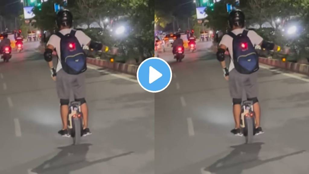 Man Riding Unicycle and balancing a cycle bearing just one wheel on the roads of India people caught the incident on camera Man Riding Unicycle and balancing a cycle bearing just one wheel on the roads of India people caught the incident on camera