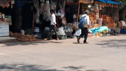 Shopkeepers at the Mumbai Agricultural Produce Grain Market display their wares on the road