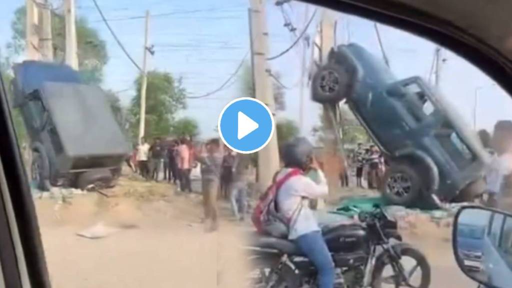 Woman Driven Mahindra Thar SUV stuck on a roadside pole after it collided with Honda Amaze vehicle Watch This Dramatic Video Woman Driven Mahindra Thar SUV stuck on a roadside pole after it collided with Honda Amaze vehicle Watch This Dramatic Video