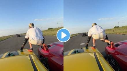 man stands on top of two speeding cars and when both cars reach a third car And Jump on It ahead watch viral video ones