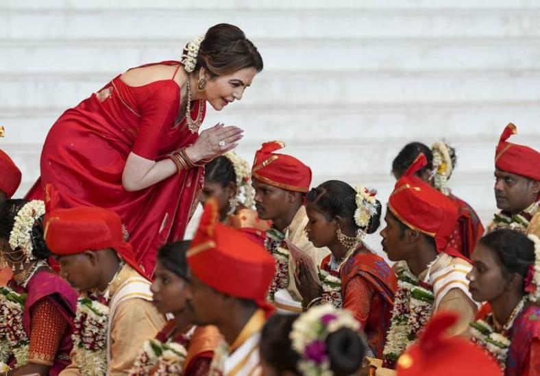 ambani family mass wedding nita ambani red saree viral