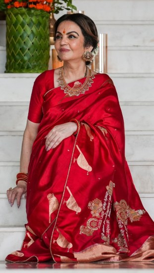 ambani family mass wedding nita ambani red saree viral