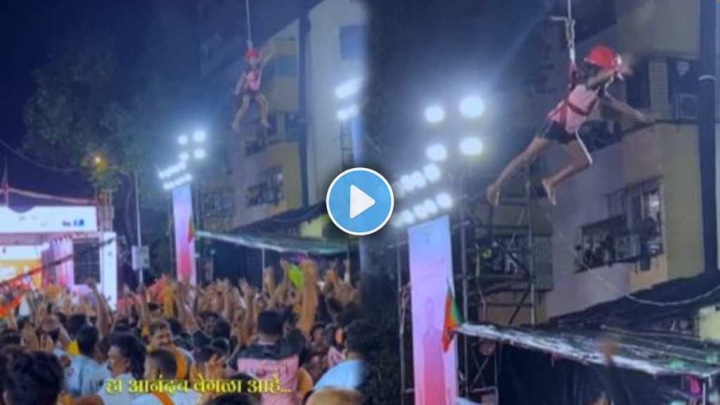The amazing dance of the little one hanging on the safety rope