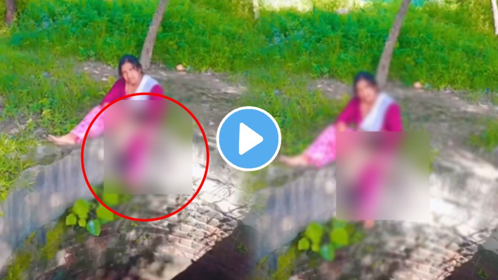 Viral Reel Shows Child Hanging As Mother Holds Her With One Hand While Posing Sitting On Well's Fence video Viral Reel Shows Child Hanging As Mother Holds Her With One Hand While Posing Sitting On Well's Fence video