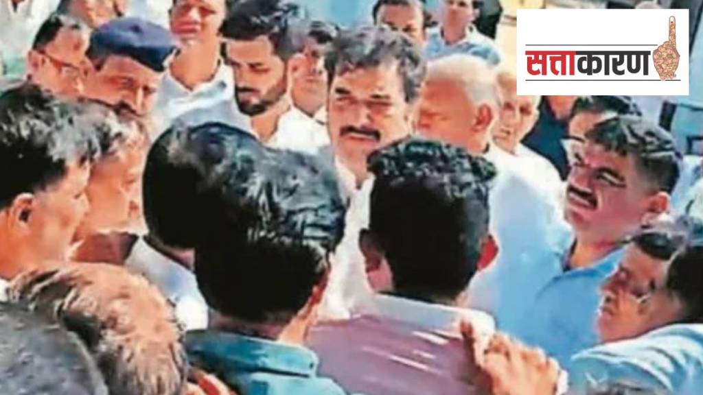 BJP leaders Kuldeep and Bhavya Bishnoi with a group of villagers in their constituency Adampur on Monday. (Express Photo BJP leaders Kuldeep and Bhavya Bishnoi with a group of villagers in their constituency Adampur on Monday. (Express Photo