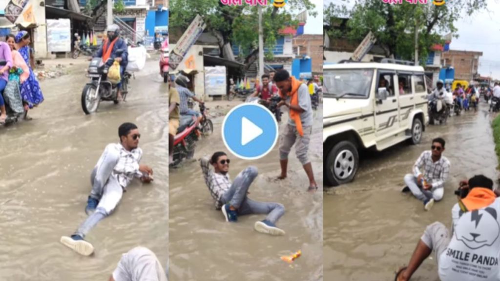 A young guy did a photo shoot in the water flooding on the road