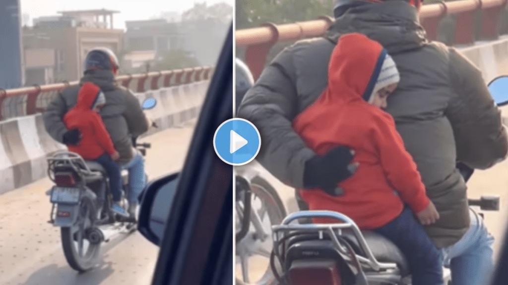 Father holds child with one hand while driving a bike with other shocking video viral on social media Father holds child with one hand while driving a bike with other shocking video viral on social media