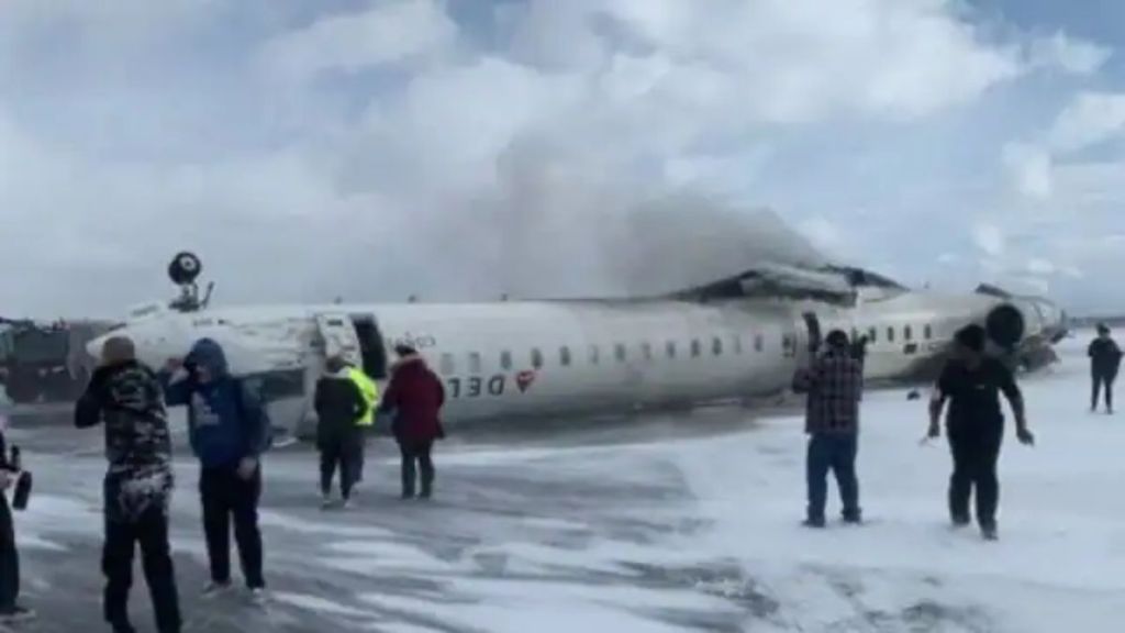 Delta Airline crash: Passengers survive after plane lands upside down, showcasing emergency evacuation efforts. Delta Airline crash: Passengers survive after plane lands upside down, showcasing emergency evacuation efforts.
