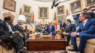 Narendra Modi and Donald Trump shake hands during their meeting discussing defense, trade, and global partnerships.