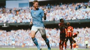 Kevin De Bruyne laughing during an interview about cricket's popularity in Europe
