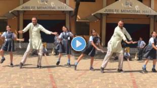students dance with teacher