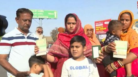 Wajida Khan standing with her children at the Attari border, holding documents and speaking to the media
